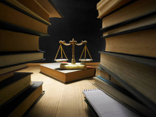 stack of books and libra scale